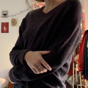 Black and white speckled sweater.